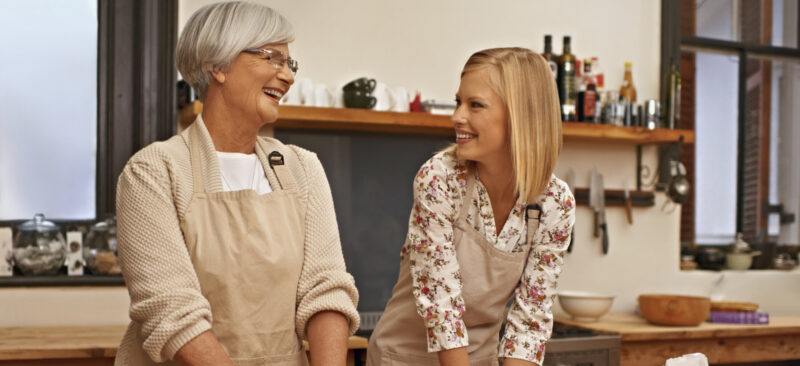 Shot of young woman learning baking tips from her grandmother